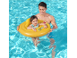 Father and baby in a yellow inflatable swim ring in a swimming pool.
