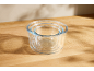 Set of glass mixing bowls on a wooden countertop.