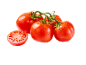 Fresh red tomatoes on the vine, one sliced in half, with water droplets.