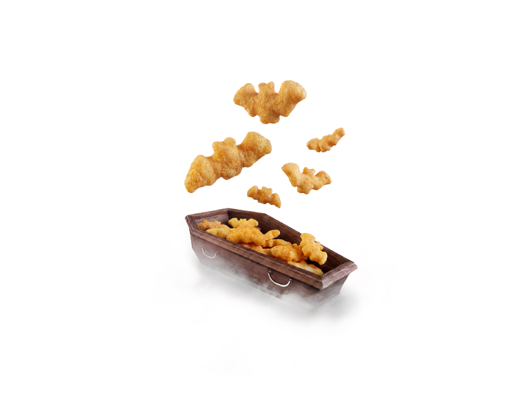 Bat-shaped snacks emerging from a coffin surrounded by mist.