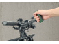 Hand tool for bike repair being used on handlebars.