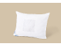 White pillow with a breathable mesh section and a blue label.
