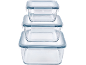 Set of three stackable glass food containers with blue plastic lids.