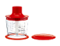 Red chopper with transparent bowl and measurements, lid next to it