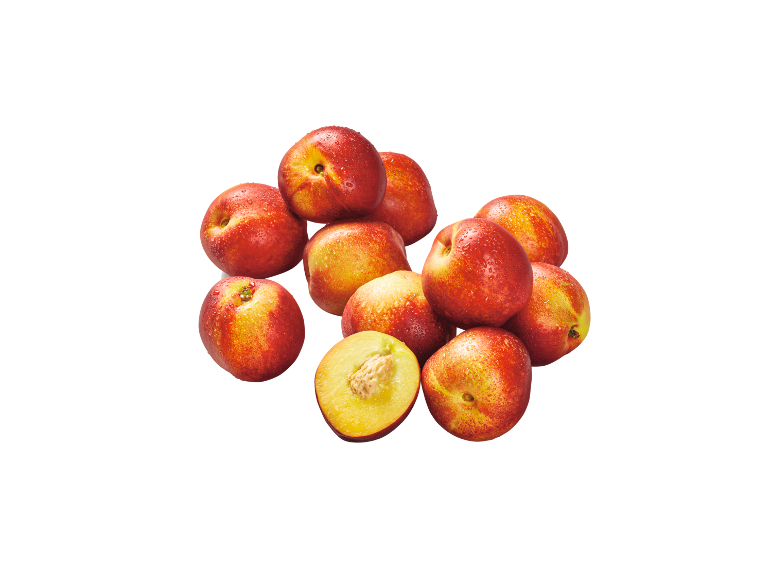 A pile of fresh nectarines with water droplets, one of them cut in half.