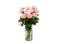 Bouquet of pink roses in a transparent glass vase on a black background.