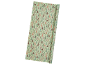 Wrapping paper with deer and Christmas tree pattern in pastel tones.