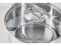 Stainless steel pot with a glass lid and measurement markings.