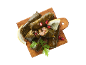 Dolmades with lemon, pomegranate, and parsley on a wooden board.
