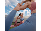 Two women in sports tops and leggings doing yoga outdoors.