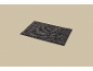 Dark grey rectangular bath mat with a looped texture.