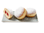 Jam-filled doughnuts dusted with powdered sugar, on a tray.