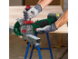 Man cutting metal with a cordless angle grinder.