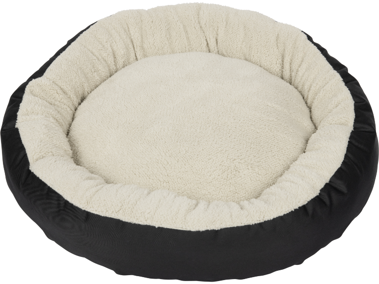 Round pet bed with a black exterior and a cream plush interior.