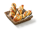Chocolate twists in a wicker basket with a striped cloth.