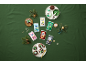 Colorful fondant packages and decorated Christmas cupcakes on a green background.