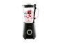 Black blender with a glass jug filled with yogurt and red berries.
