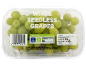 White seedless grapes in a plastic container with nutritional and recycling information.