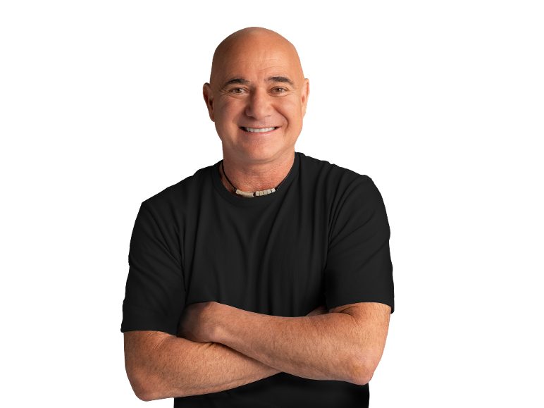 Smiling bald man in a black t-shirt and necklace, with arms crossed.