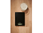 Kitchen scale and bowl of flour on a wooden surface