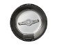 Top-down view of an electric coffee grinder's interior with blades.