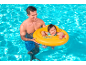 Man in pool with baby in yellow float.