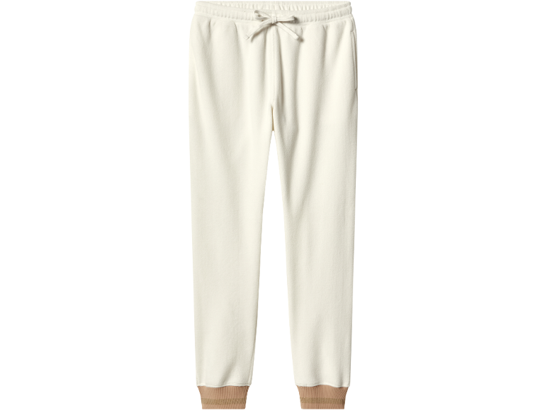 Cream fleece sweatpants with a drawstring waist and brown ribbed cuffs.