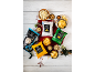 Assortment of hand-cooked crisps and popcorn, with nuts and berries on a white wooden table.