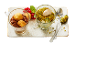 Two desserts in glass cups: tiramisu and pistachio ice cream