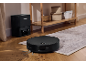Robot vacuum cleaner with auto-empty station on a wooden floor with a rug.