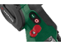 Close-up of a green power tool with red and green buttons and a red knob.