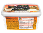 Cinnamon-flavored ice cream and cake pieces on a tub, with nutritional information.