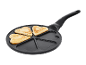 Frying pan with three heart-shaped pancakes, with empty spaces for more.