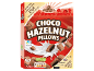 Pack of chocolate-hazelnut pillows falling into milk, highlighting prizes and nutritional information.