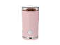 Pink coffee grinder filled with coffee beans.