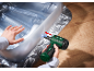 Green electric inflator inflating a transparent inflatable mattress on a wooden floor.