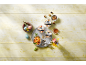 Three desserts, a fruit bowl, Easter eggs, and flowers on a table.