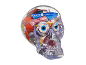 Clear skull filled with assorted Halloween candy, including gummy eyeballs and wrapped sweets.