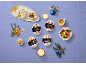 Individual ice creams: coffee, hazelnut, peach, vanilla, banana, caramel, and macadamia, with Christmas decorations.