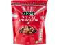 Pouch of fruit and nut chocolate mix, with nutritional indicators and vegetarian seal.