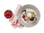 Chocolate brownie with ice cream, raspberries, and amaretti on a plate.