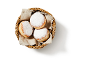 Sugared doughnuts in a wicker basket with a linen cloth.