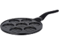 Pancake pan with seven smiling face molds.