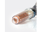 Transparent shower filter with orange granules on a white background.