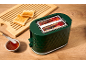 Green toaster with two slices of toast on a wooden board and a bowl of jam.