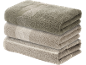 Stacked pile of three towels in beige and olive green with a leaf pattern.