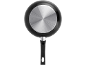 Bottom view of a black frying pan with a silver, circular base and black handle.