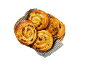 Basket with four puff pastry swirls with raisins and cream, on a striped cloth.