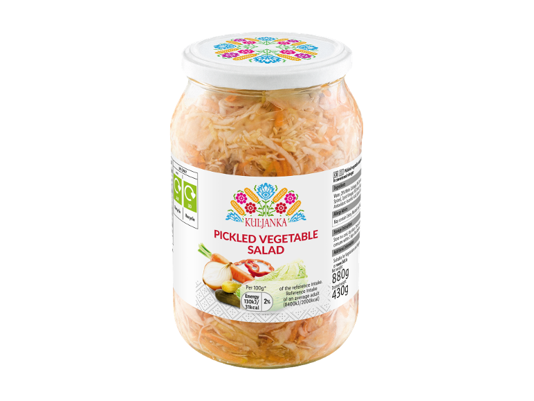 Pickled vegetable salad in a glass jar with a decorated lid, label with nutritional information.