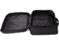 Open black travel bag with interior compartments and fastening straps.